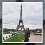 Madison Krigbaum standing in front of the Eiffel Tower in Paris, featured in the first photo ever posted to her travel blog’s Instagram