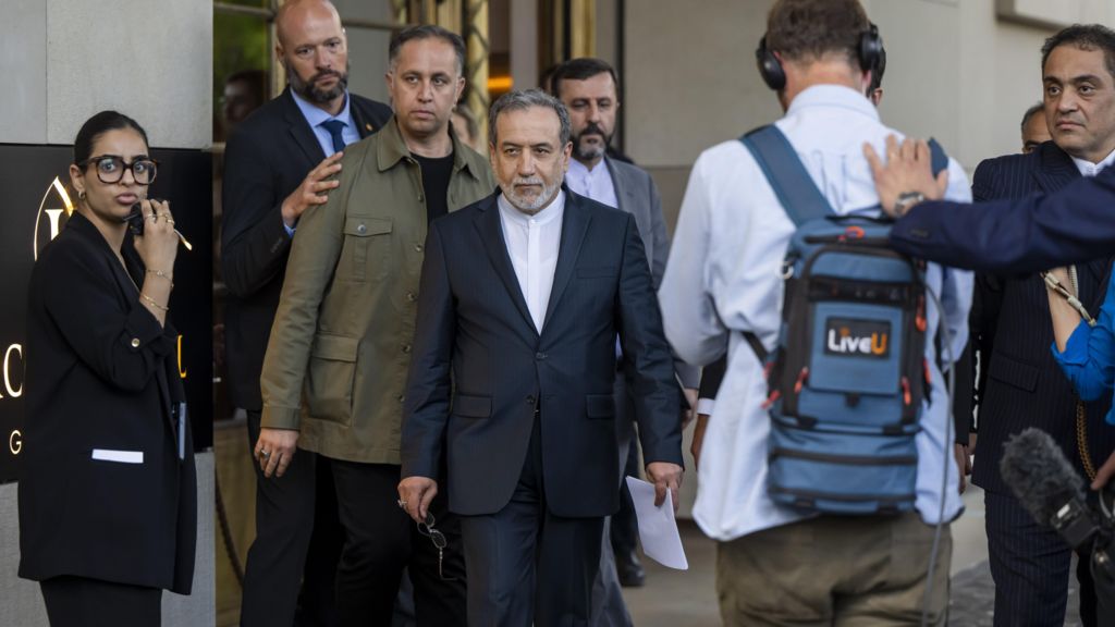Iranian Foreign Minister Abbas Araghchi talking to the media in front of the Intercontinental Hotel, after a meeting of foreign ministers of German